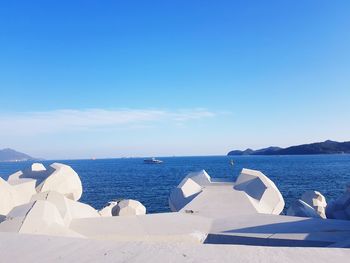 Scenic view of sea against blue sky