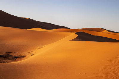 Scenic view of desert against clear sky