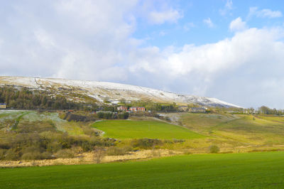 Denshaw village with snow on the hills in saddleworth in oldham, within greater manchester