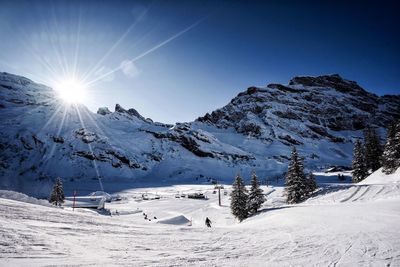 Scenic view of snowcapped mountains against clear sky