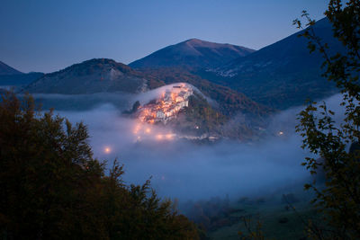 Scenic view of mountains against sky in foggy weather at abruzzo national park