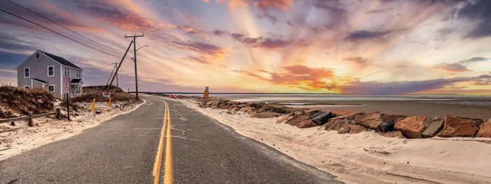 Roadway along chapin beach in cape cod, massachusetts at sunset.