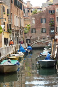 Boats moored in canal