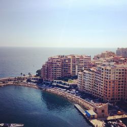 View of sea with cityscape in background