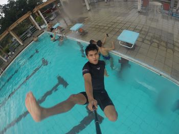 High angle view of woman swimming in pool