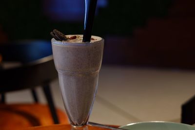 Close-up of coffee in glass on table