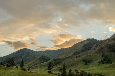 Scenic view of mountains against sky during sunset