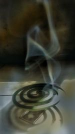 Digital composite image of cigarette on table