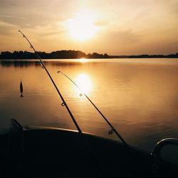 Scenic view of lake at sunset