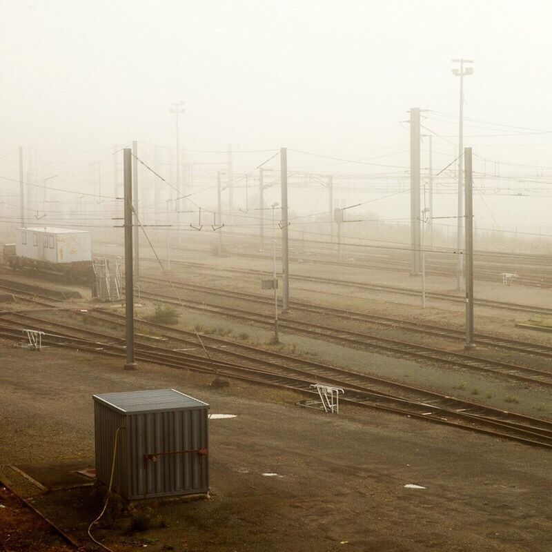 electricity pylon, sky, no people, built structure, landscape, fog, outdoors, nature, day, petrochemical plant