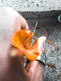 Close-up of hand holding small ring