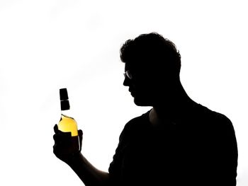 Portrait of a man drinking water from bottle