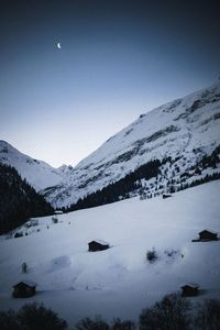 Scenic view of snow covered mountains