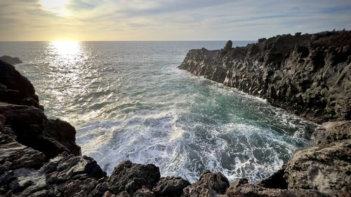 Scenic view of sea against sky during sunset