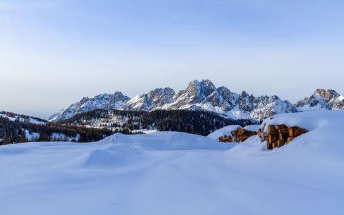 Scenic view of landscape against sky during winter