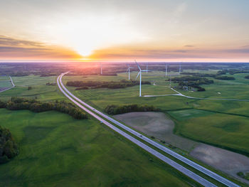 Scenic view of field against sky during sunset