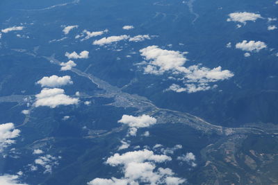 Aerial view of clouds over mountain