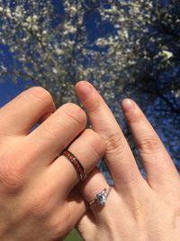 Cropped image of couple holding hands