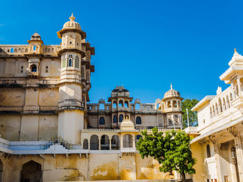 Low angle view of building against blue sky