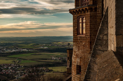 View of old ruin building against cloudy sky