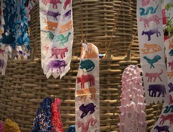 Low angle view of multi colored hanging for sale at market stall