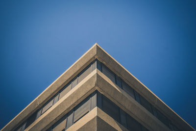 Low angle view of building against blue sky