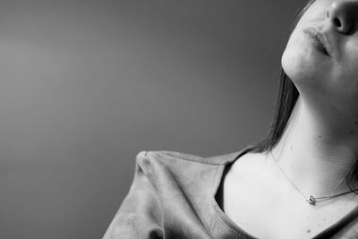 Woman looking at camera over white background