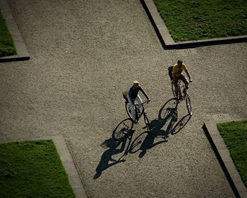 High angle view of people on bicycle in city