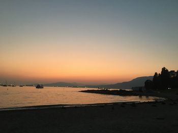 Scenic view of sea against clear sky during sunset