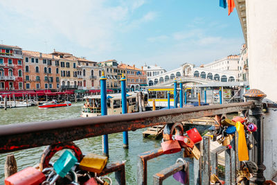 Bridge over canal against buildings in city