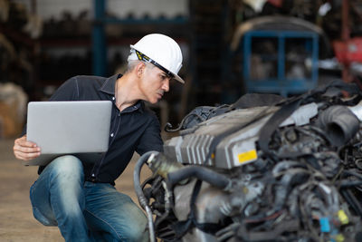 Man working on motorcycle