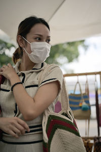 Series photo of young women choosing new shopping bag in street market , refreshing look concept