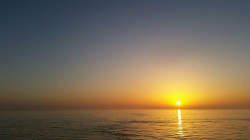 Scenic view of sea at sunset