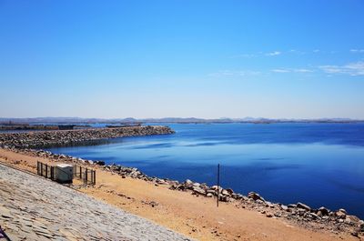 Scenic view of sea against blue sky