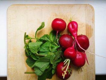 Directly above shot of red beetroot with mint on cutting board