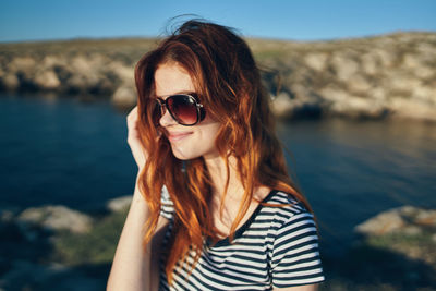 Portrait of young woman wearing sunglasses