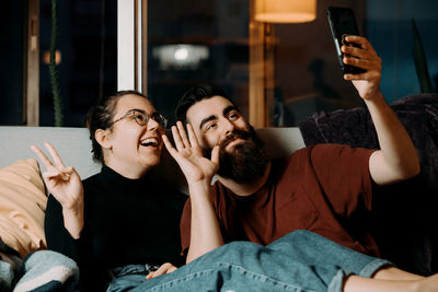 Low angle view of woman using mobile phone