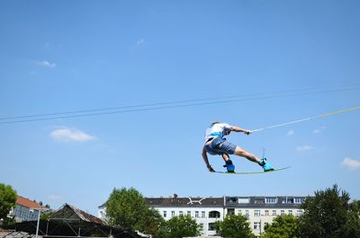 Low angle view of kite flying in sky