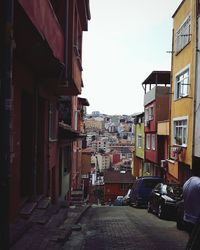 Houses in city against sky