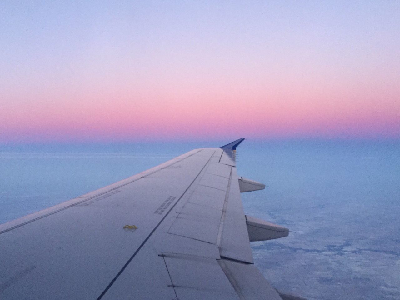 flying, sea, horizon over water, transportation, aircraft wing, airplane, part of, sunset, sky, mode of transport, air vehicle, clear sky, cropped, water, scenics, beauty in nature, copy space, nature, mid-air, travel