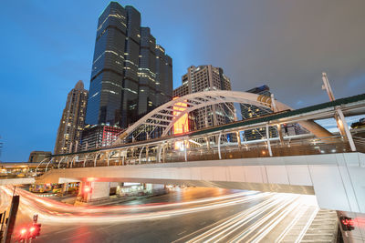 Low angle view of illuminated buildings against sky at night