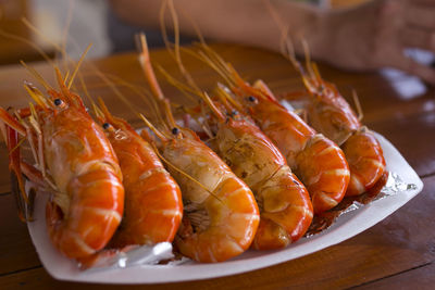 Close-up of prawns in plate on table