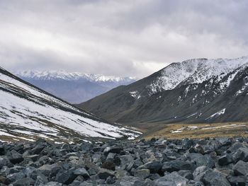 Scenic view of snowcapped mountains against sky