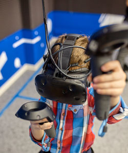 Close-up of man photographing with camera