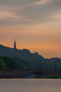 View of temple bridge against sky during sunset