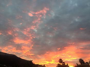 Low angle view of dramatic sky during sunset