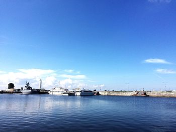 Boats moored at harbor