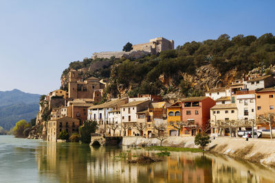 Buildings reflecting on ebro river