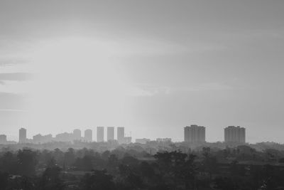 Buildings in city against sky