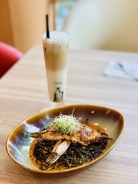 Spicy squid ink pasta with ice milk tea 